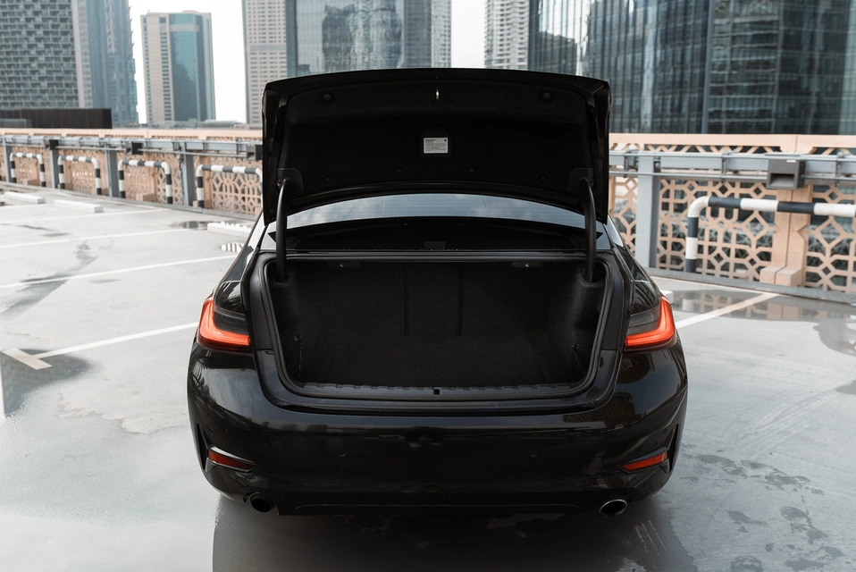 Rent a BMW 330i black, 2021 in Dubai